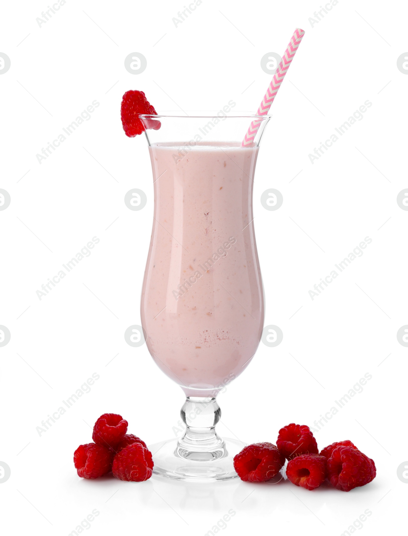 Photo of Tasty raspberry milkshake in glass and berries isolated on white