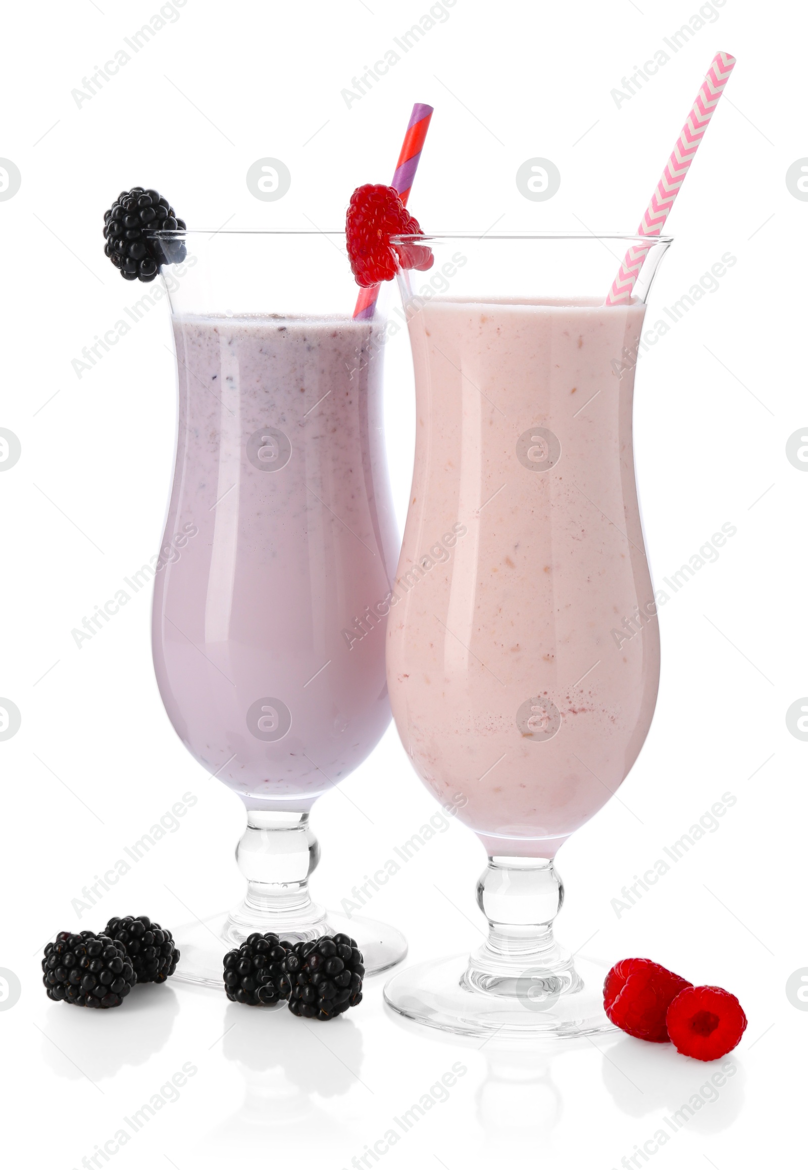 Photo of Different tasty milkshakes in glasses and ingredients isolated on white