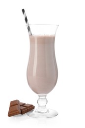 Photo of Tasty milkshake in glass and pieces of chocolate isolated on white