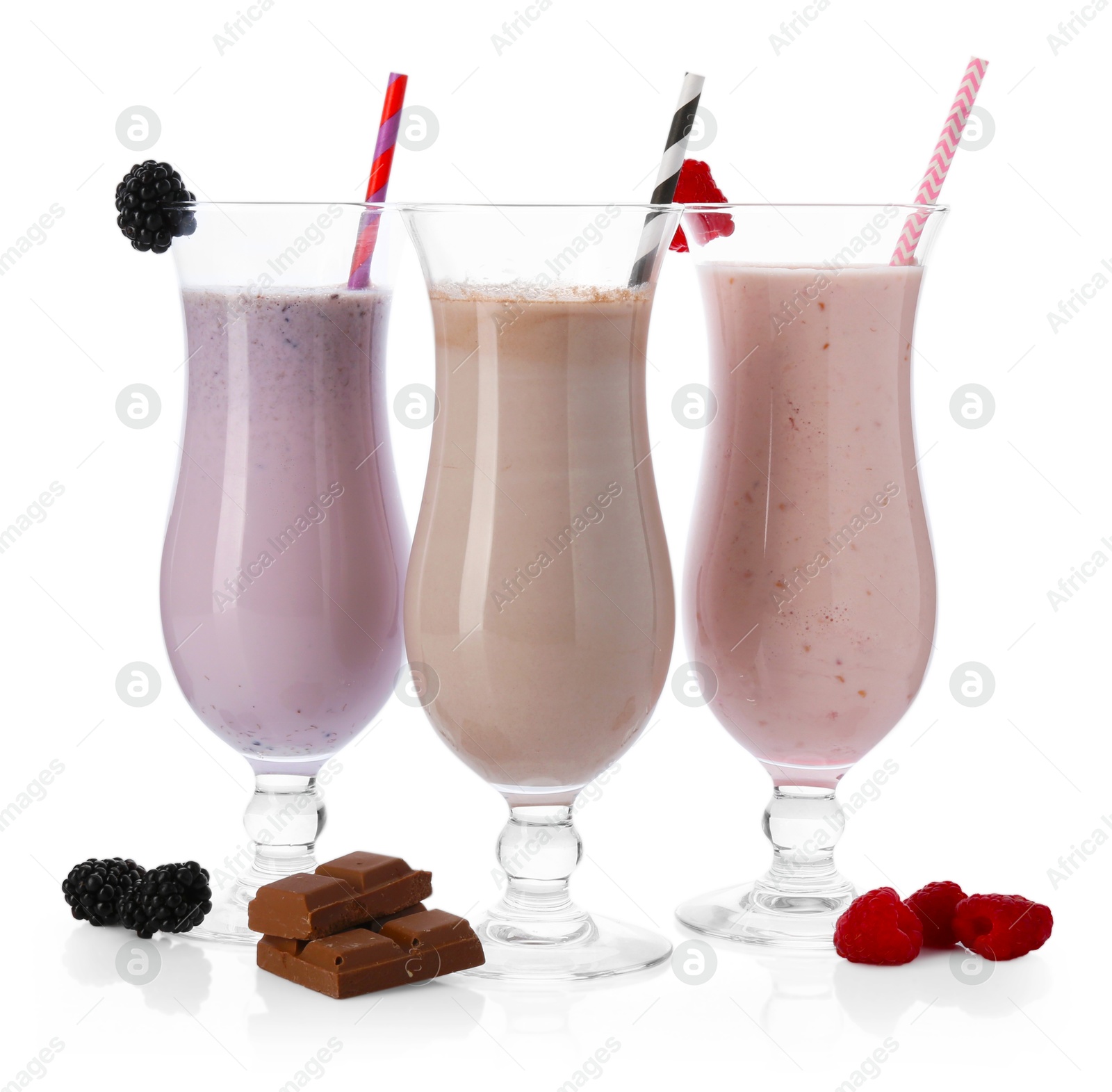 Photo of Different tasty milkshakes in glasses and ingredients isolated on white