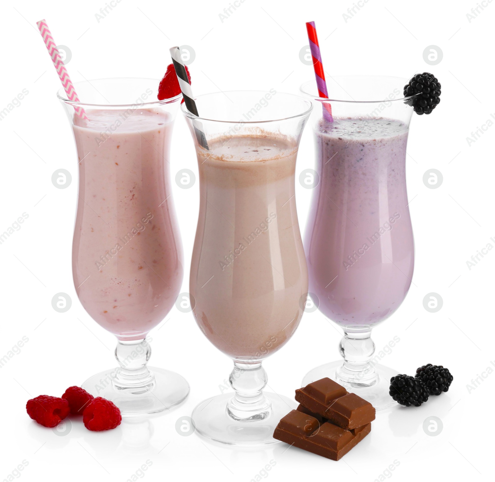 Photo of Different tasty milkshakes in glasses and ingredients isolated on white