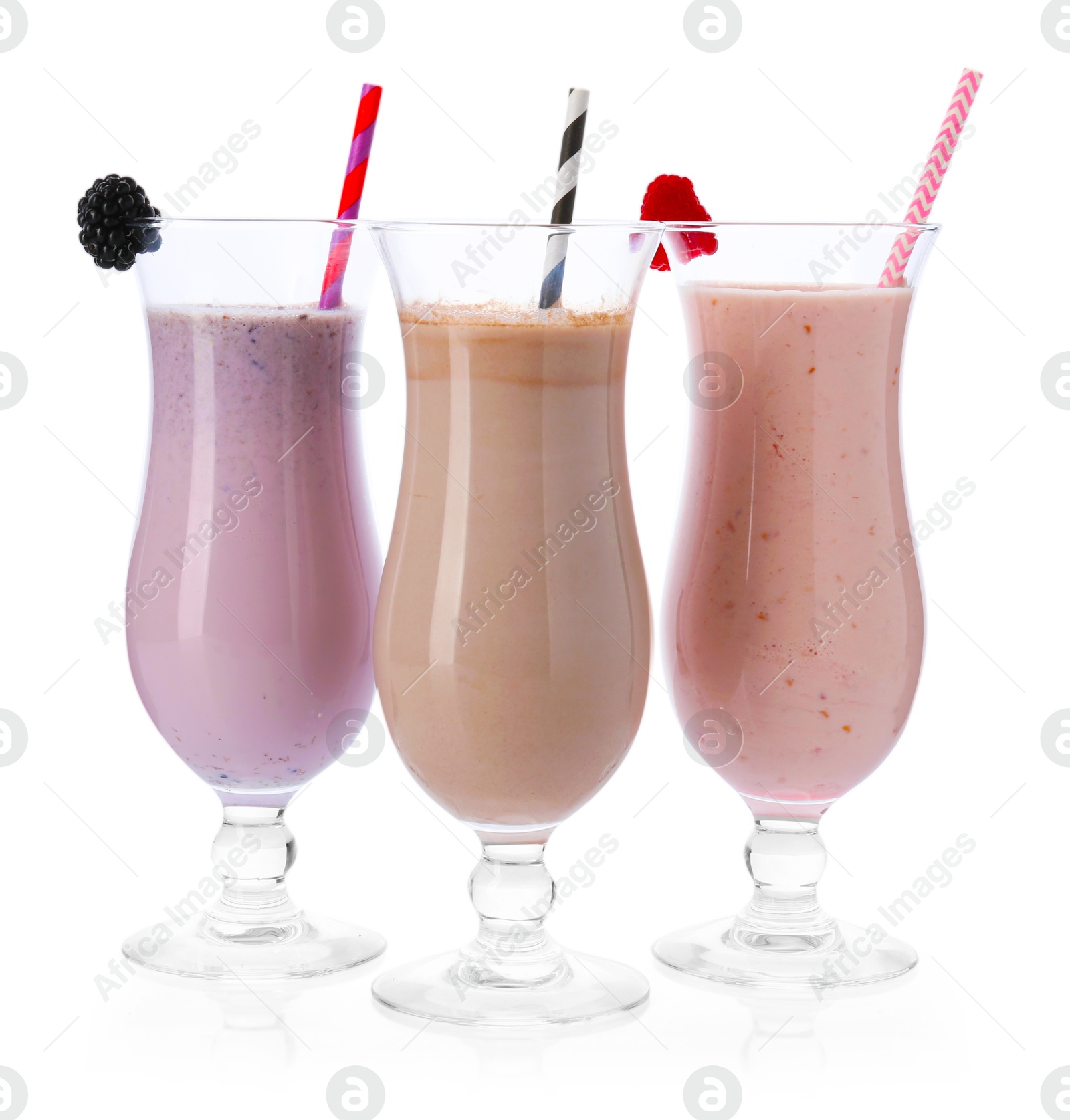 Photo of Different tasty milkshakes in glasses isolated on white