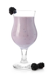 Photo of Tasty blackberry milkshake in glass and berries isolated on white