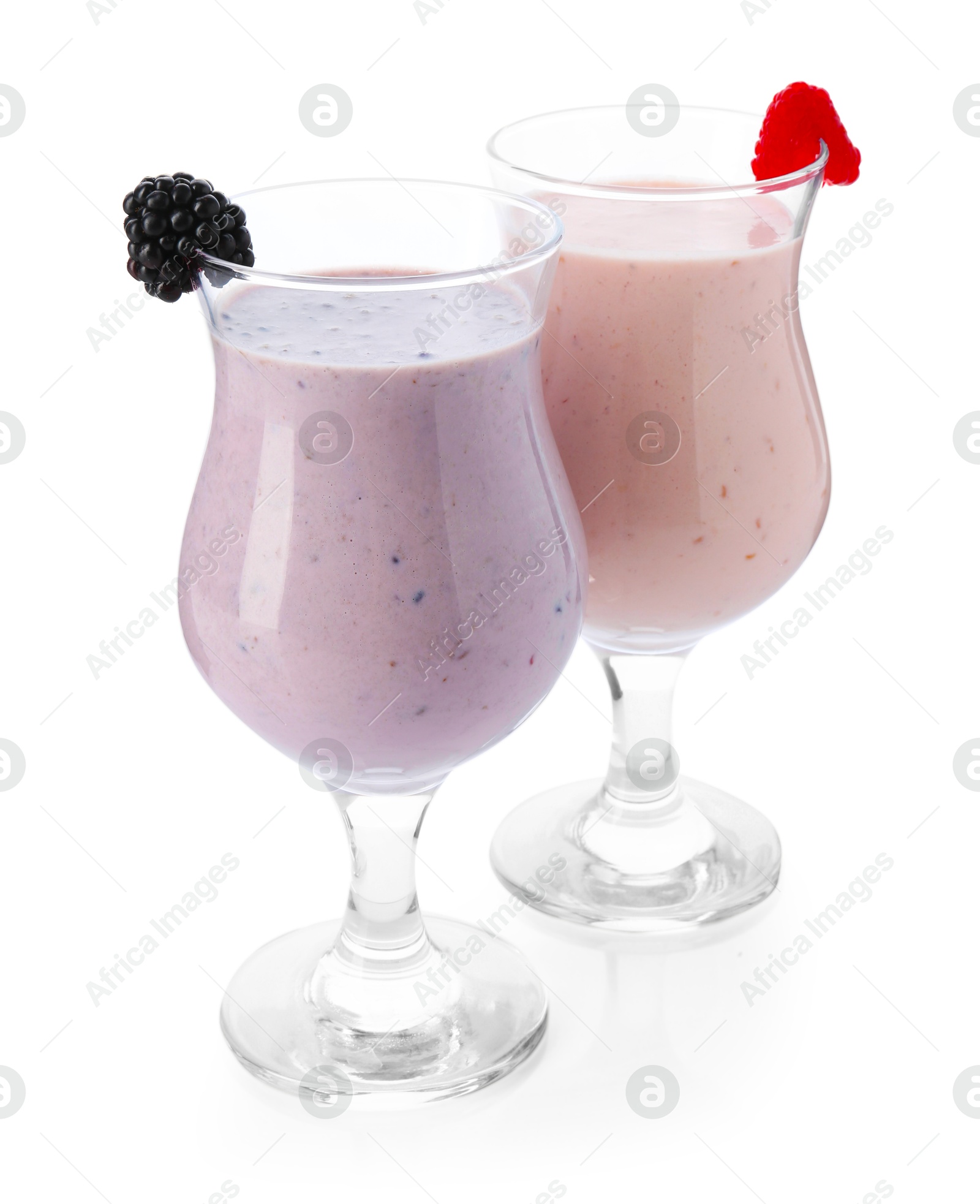 Photo of Different tasty milkshakes in glasses isolated on white