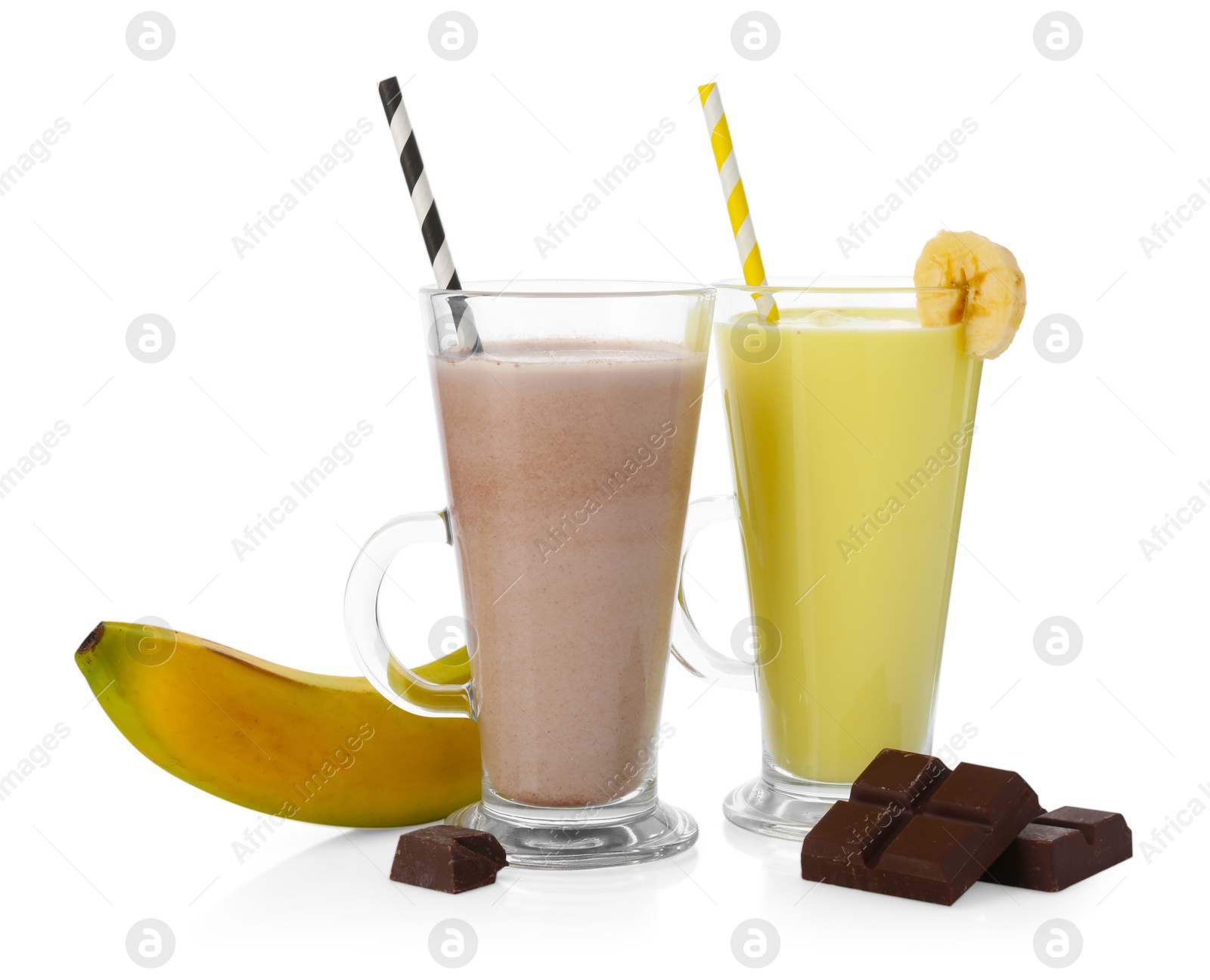 Photo of Different tasty milkshakes in glasses and ingredients isolated on white