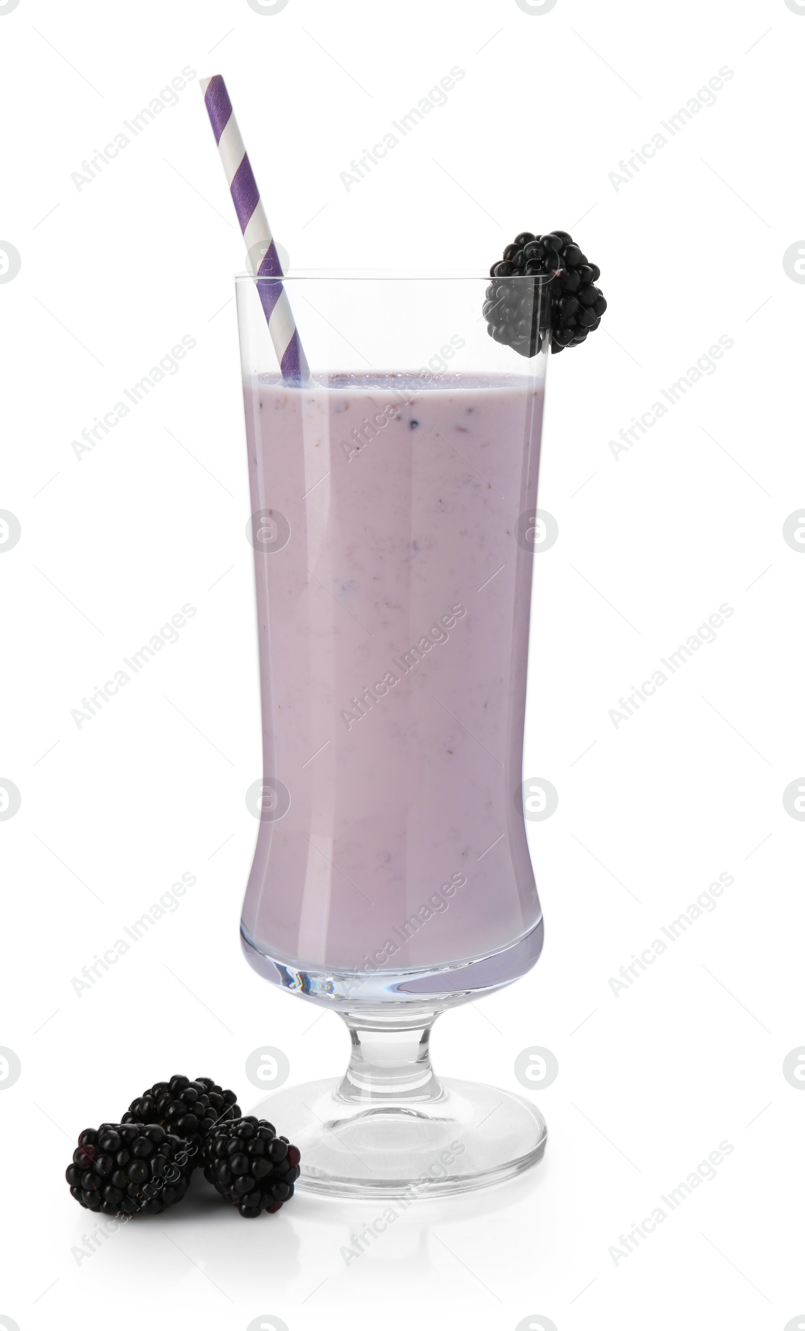 Photo of Tasty blackberry milkshake in glass and berries isolated on white