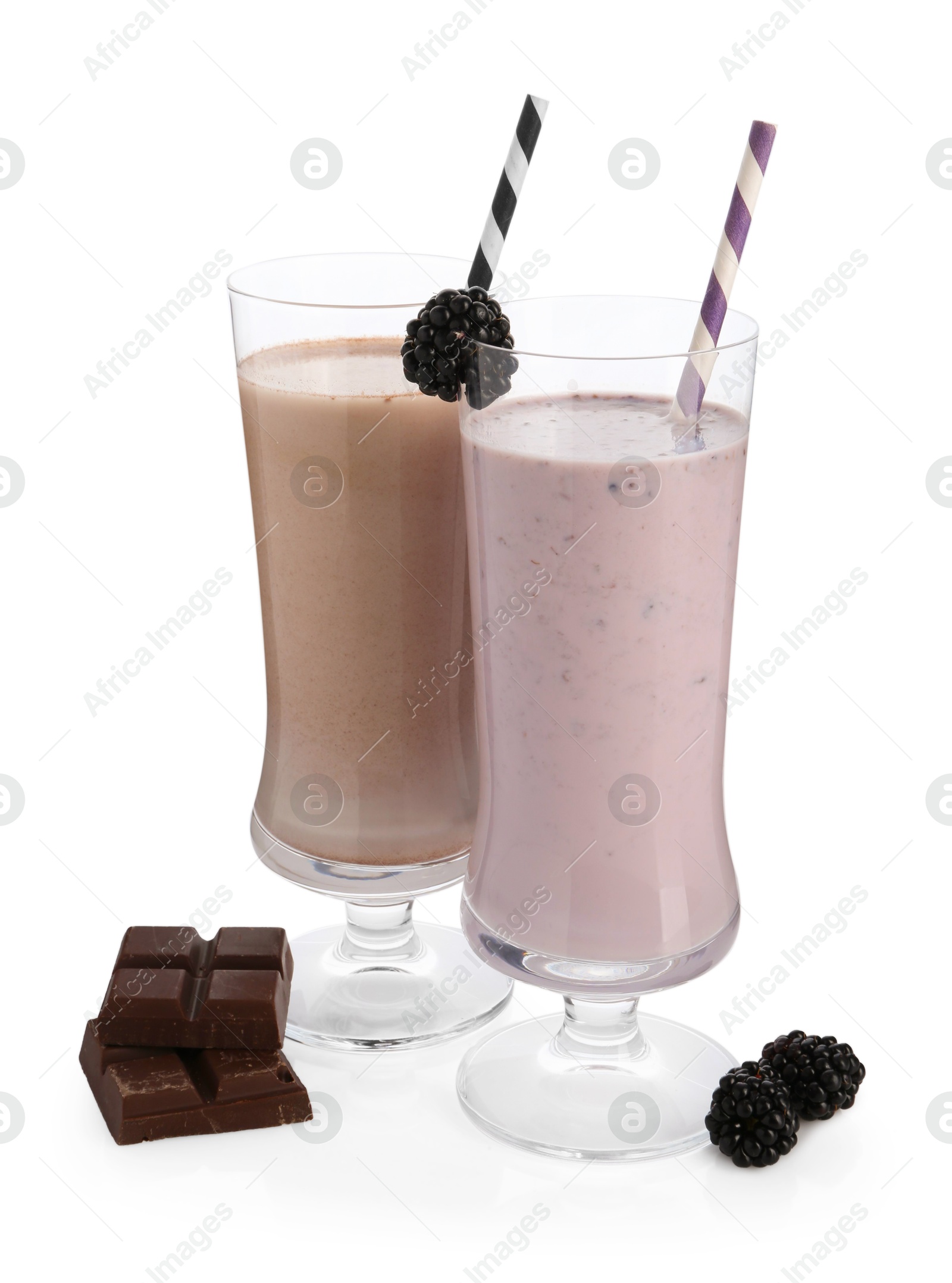 Photo of Different tasty milkshakes in glasses and ingredients isolated on white