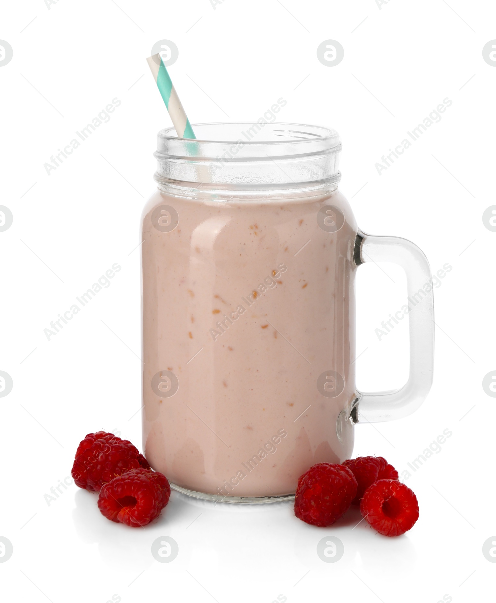 Photo of Tasty raspberry milkshake in mason jar and berries isolated on white