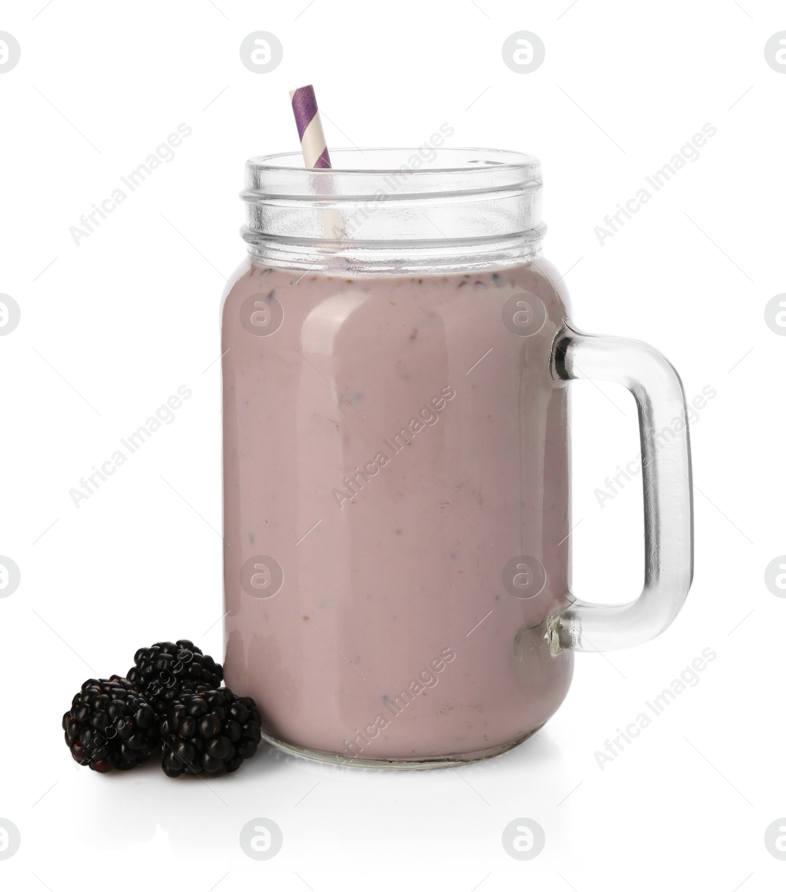 Photo of Tasty blackberry milkshake in mason jar and berries isolated on white