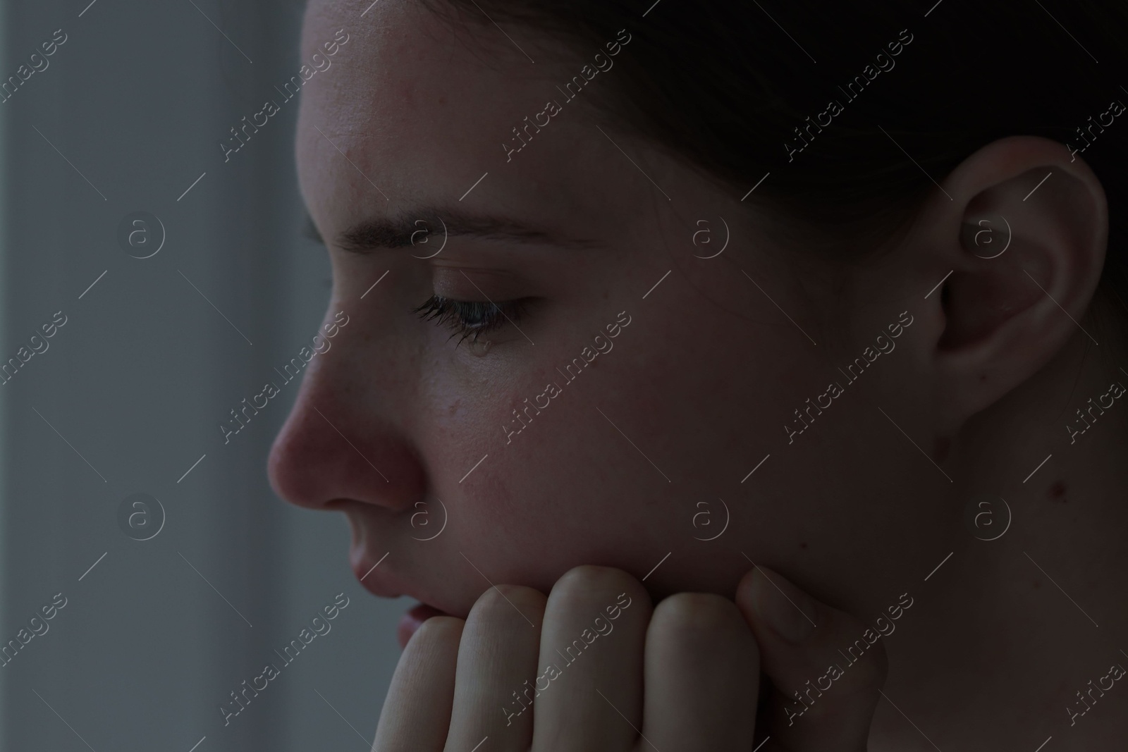 Sad young woman at home, closeup. Depression concept Photo of Sad young woman at home, closeup. Depression concept