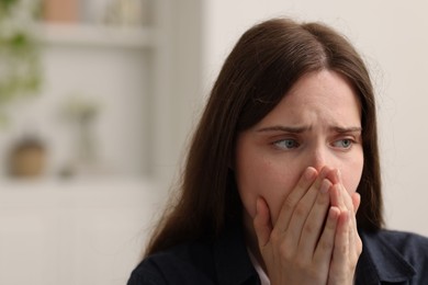 Photo of Sad young woman at home. Depression concept