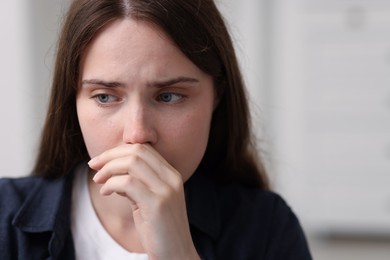 Photo of Sad young woman at home. Depression concept