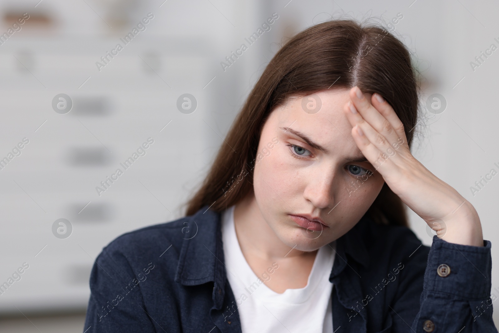 Photo of Sad young woman at home. Depression concept