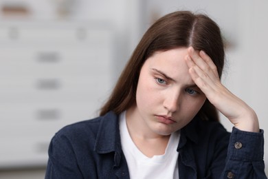 Photo of Sad young woman at home. Depression concept