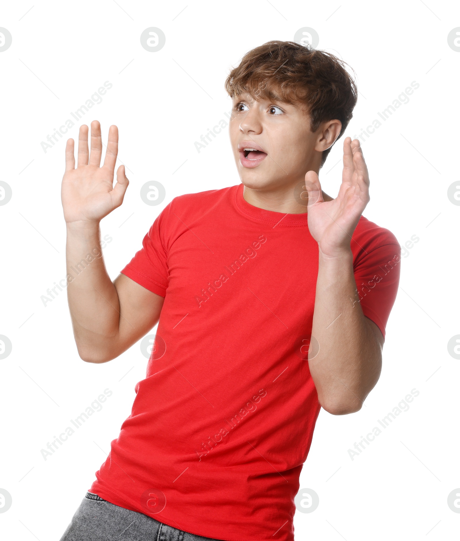 Photo of Teenage boy suffering from panic attack on white background