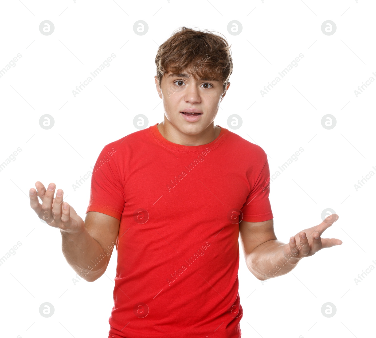 Photo of Teenage boy suffering from panic attack on white background