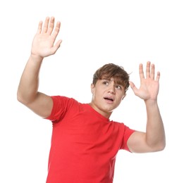 Photo of Teenage boy suffering from panic attack on white background