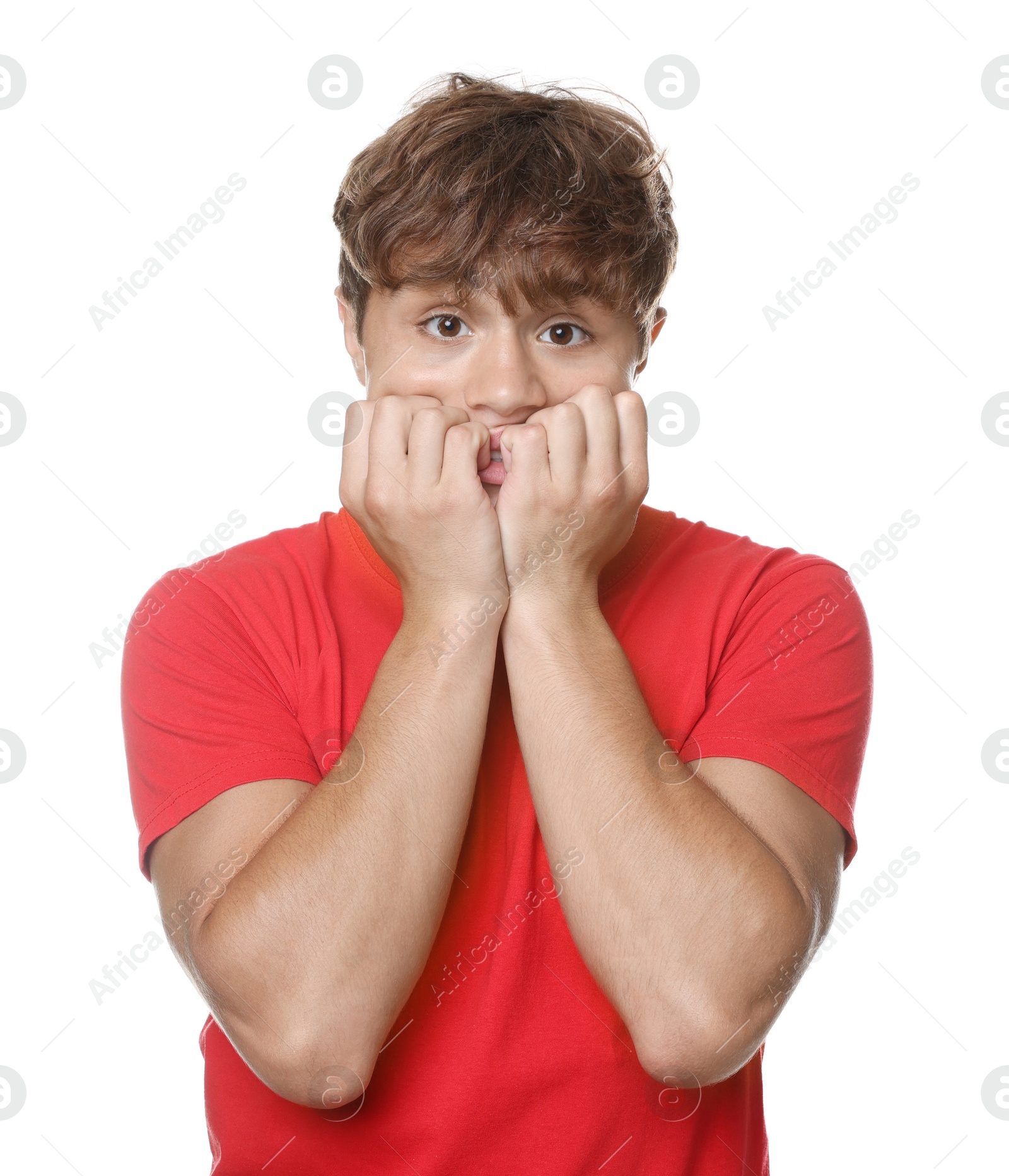 Photo of Teenage boy suffering from panic attack on white background