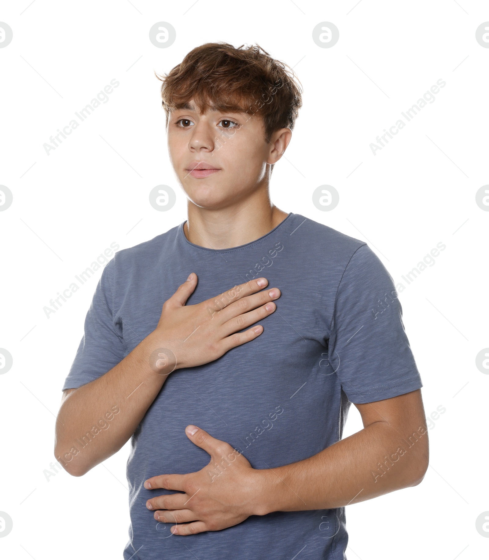 Photo of Teenage boy deep breathing on white background. Way to stop panic attack