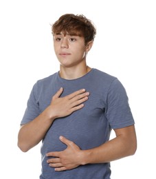 Photo of Teenage boy deep breathing on white background. Way to stop panic attack