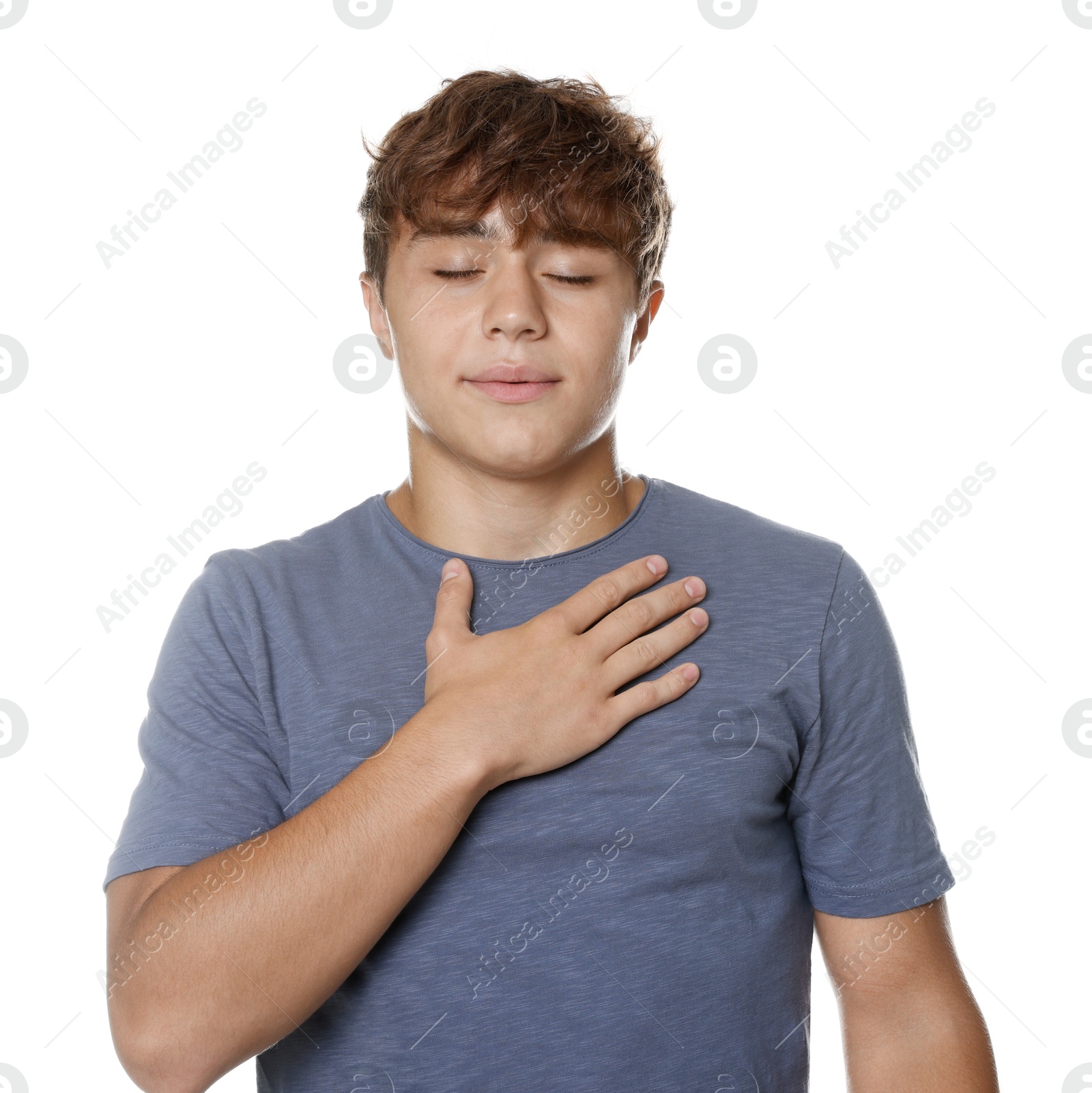Photo of Teenage boy deep breathing on white background. Way to stop panic attack