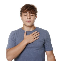 Photo of Teenage boy deep breathing on white background. Way to stop panic attack