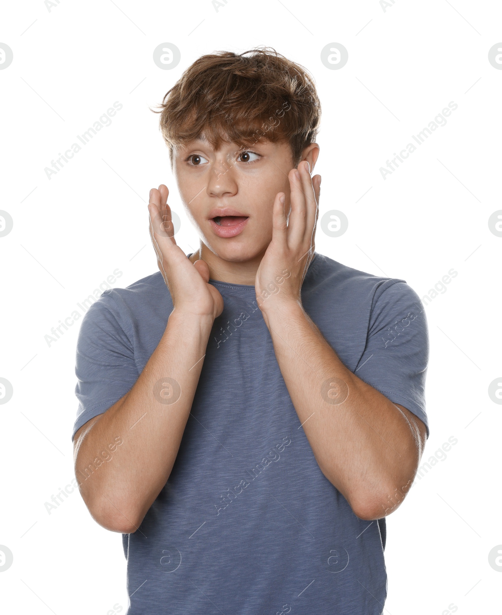 Photo of Teenage boy suffering from panic attack on white background