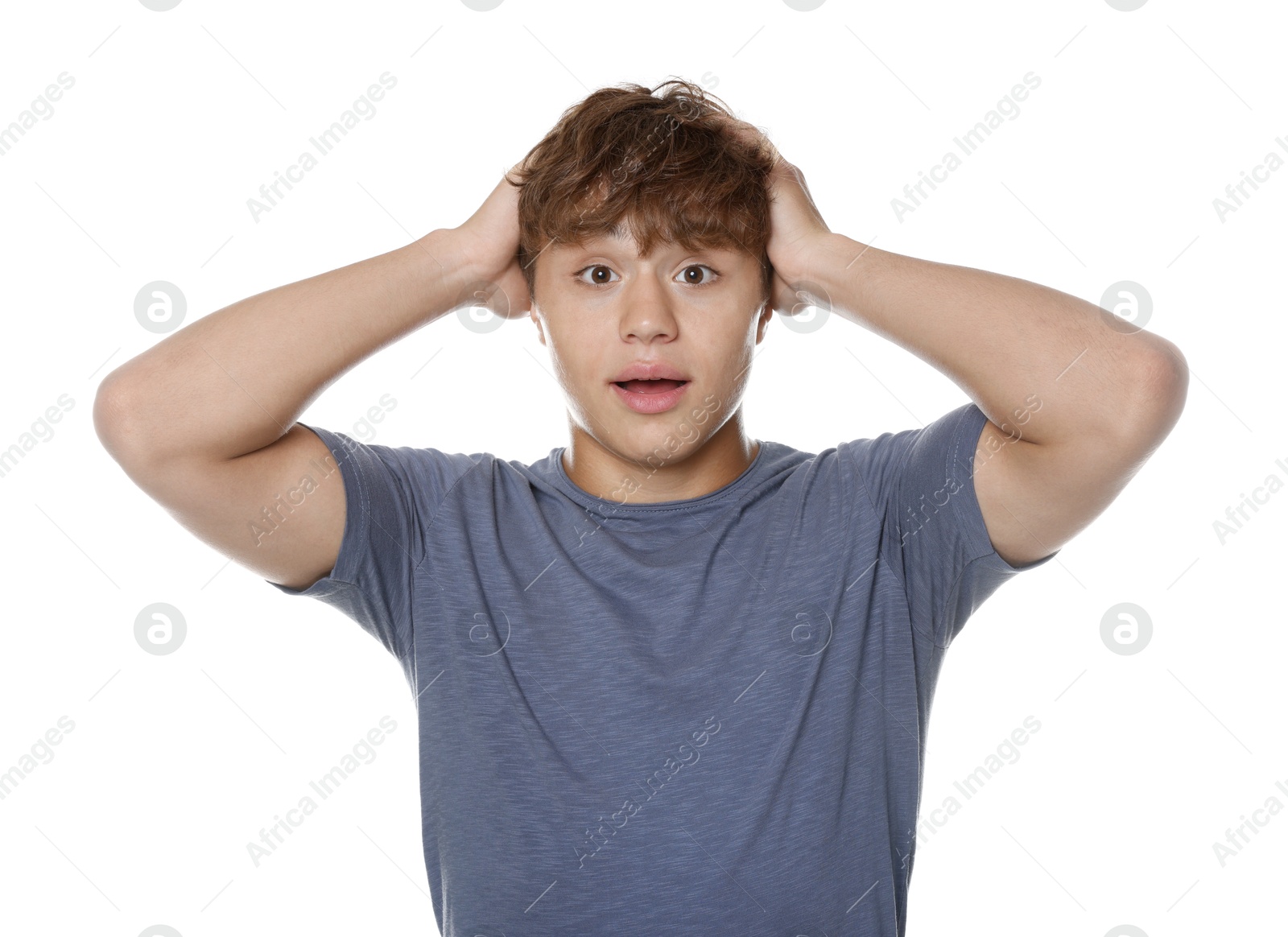 Photo of Teenage boy suffering from panic attack on white background