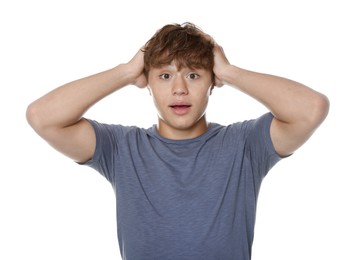 Photo of Teenage boy suffering from panic attack on white background