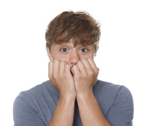 Photo of Teenage boy suffering from panic attack on white background