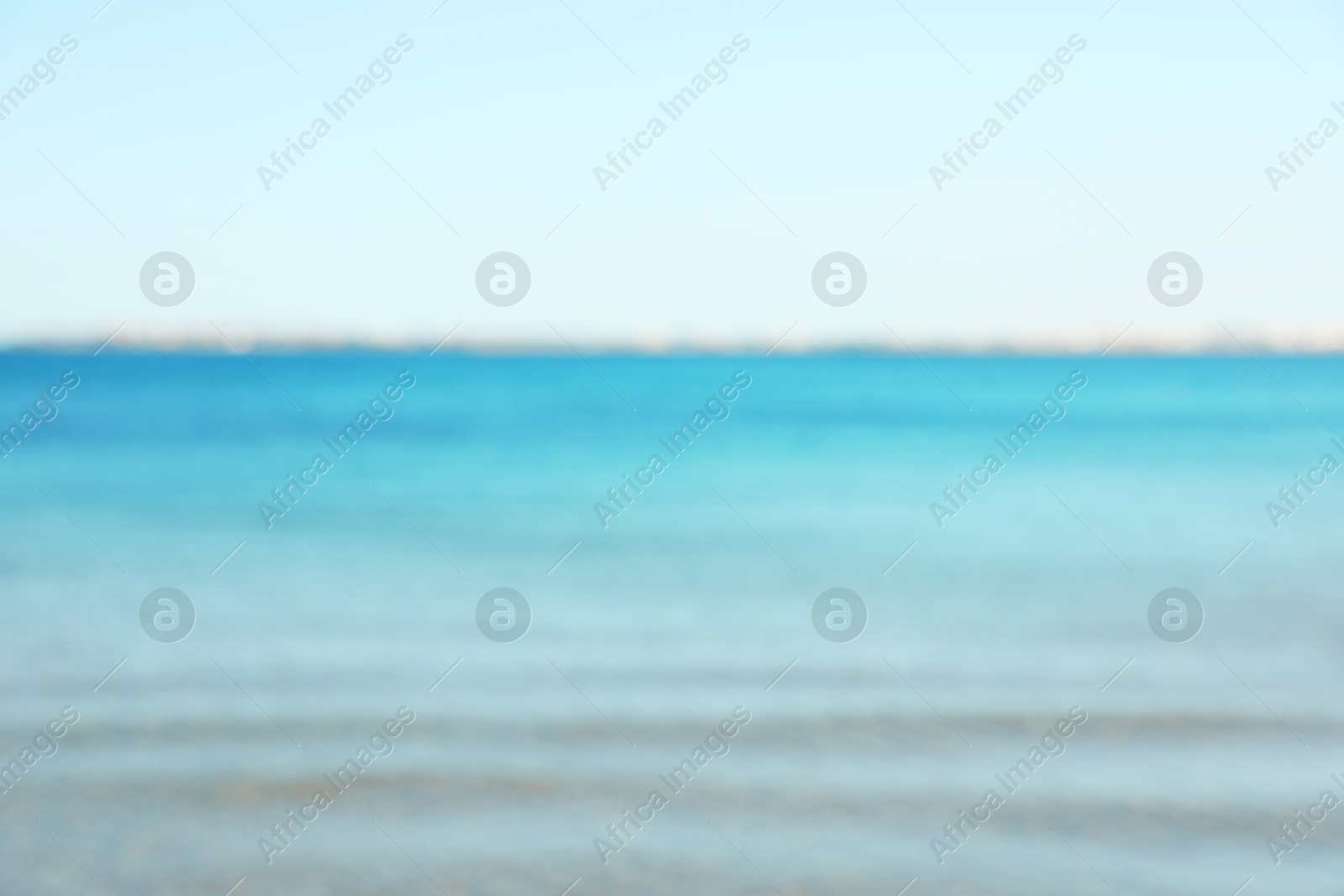 Photo of Beautiful sea under light blue sky, blurred view