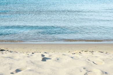 Photo of Beautiful wavy sea and sandy beach on sunny morning