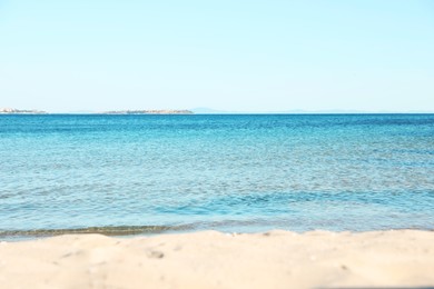 Photo of Beautiful sea and sandy beach under light blue sky
