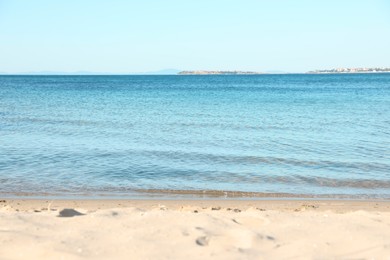 Photo of Beautiful sea and sandy beach under light blue sky