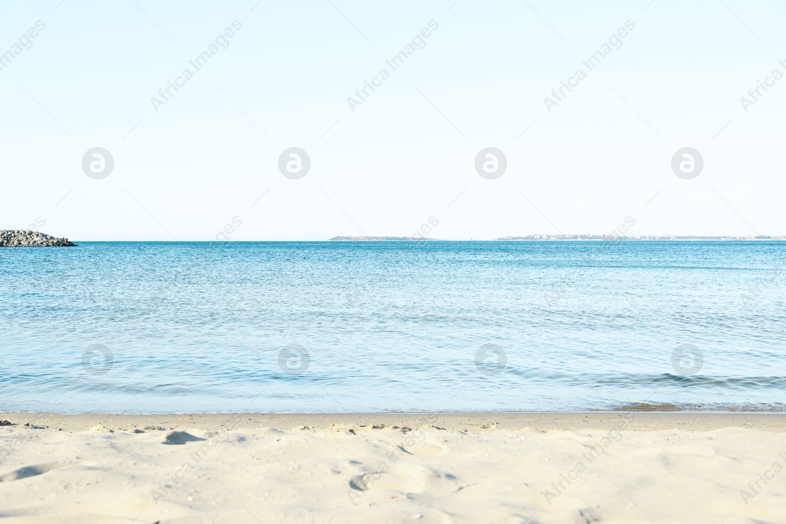 Photo of Beautiful sea and sandy beach under cloudless sky