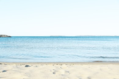 Photo of Beautiful sea and sandy beach under cloudless sky