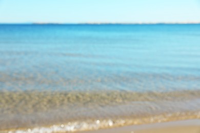 Photo of Wavy sea under light blue sky, blurred view