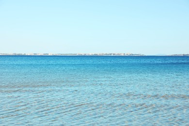 Photo of Beautiful wavy sea under cloudless sky on summer morning