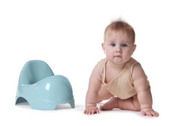 Photo of Cute little baby crawling near potty on white background