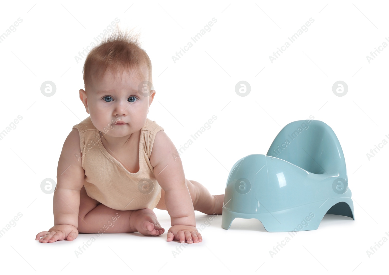 Photo of Cute little baby crawling near potty on white background