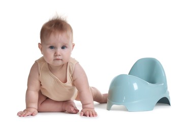 Photo of Cute little baby crawling near potty on white background