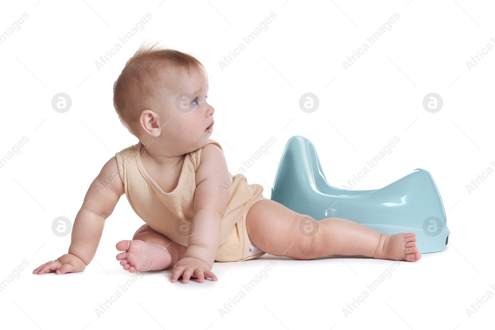 Photo of Cute little baby sitting near potty on white background