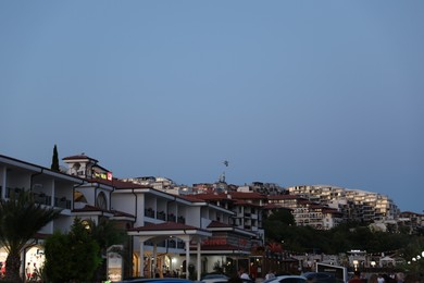 Photo of Sveti Vlas, Bulgaria - July 11, 2025: Hotel buildings in evening city under blue sky