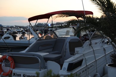 Photo of Sveti Vlas, Bulgaria - July 11, 2025: Stylish moored boat in sea port at sunset