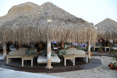 Photo of Sveti Vlas, Bulgaria - July 11, 2025: Beautiful gazebo with comfortable furniture at luxury resort outdoors