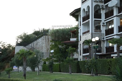 Photo of Sveti Vlas, Bulgaria - July 11, 2025: Hotel building and palm trees outdoors