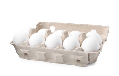 Photo of Raw chicken eggs in egg carton isolated on white