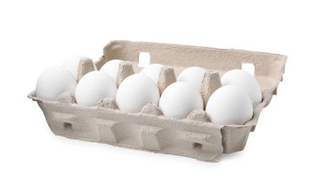 Photo of Raw chicken eggs in egg carton isolated on white