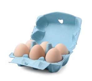 Photo of Raw chicken eggs in egg carton isolated on white