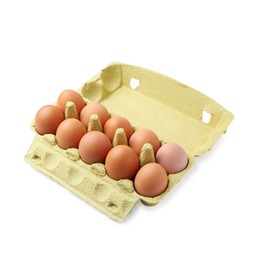 Photo of Raw chicken eggs in egg carton isolated on white